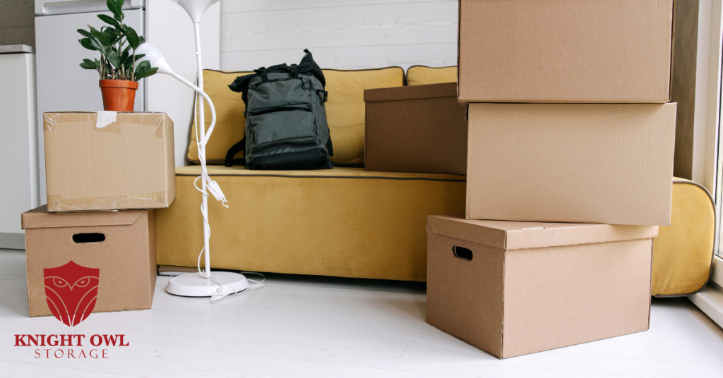 Knight Owl Storage logo with stacked storage boxes and moving supplies