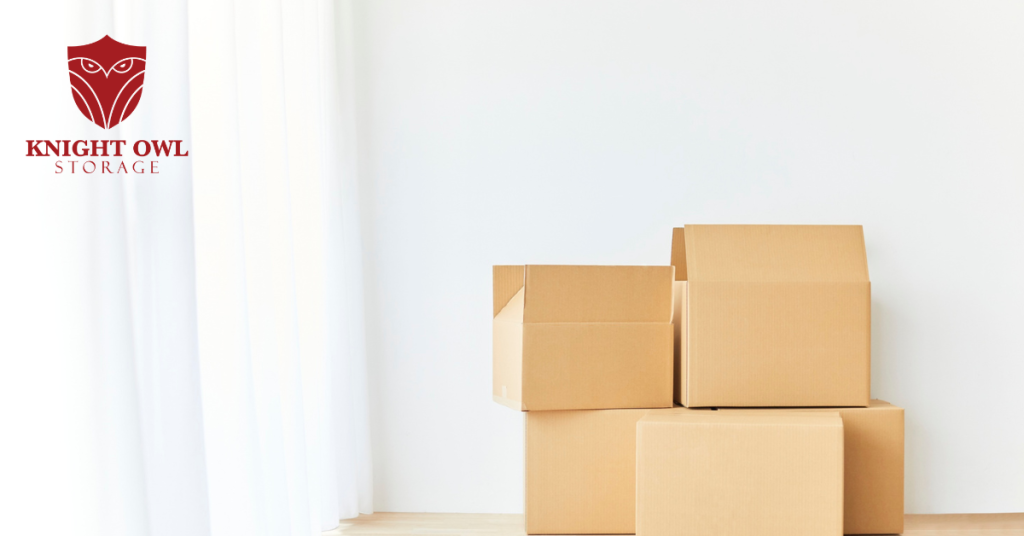 Knight Owl Storage logo with packed moving boxes